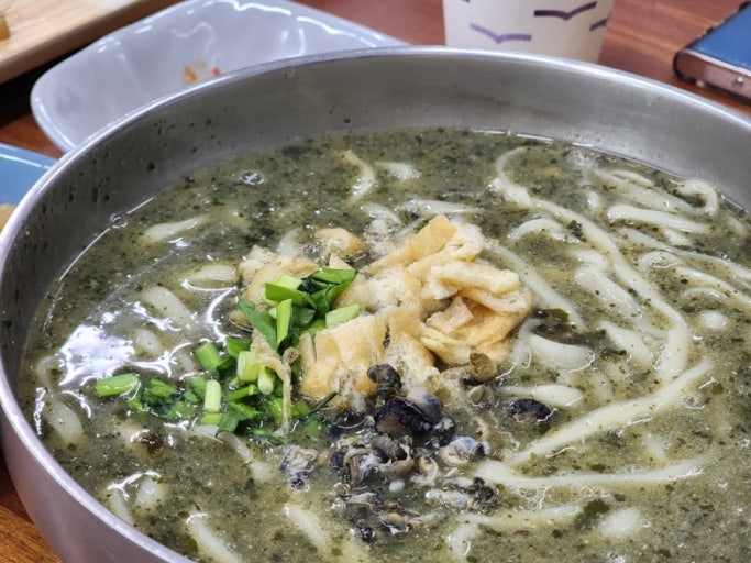 noodle soup with brown turban shell